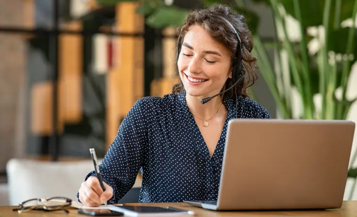 Photo of a sales person with a laptop